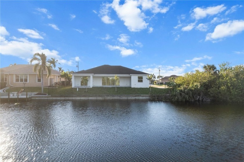 WATERFRONT NEW CONSTRUCTION HOME comes loaded with upgrades - Beach Home for sale in Cape Coral, Florida on Beachhouse.com