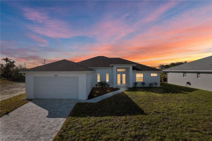 WATERFRONT NEW CONSTRUCTION HOME comes loaded with upgrades - Beach Home for sale in Cape Coral, Florida on Beachhouse.com