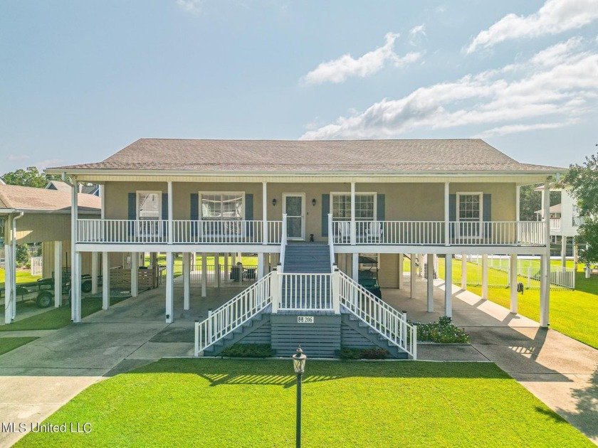 This perfectly maintained waterfront home has so much to offer - Beach Home for sale in Pass Christian, Mississippi on Beachhouse.com