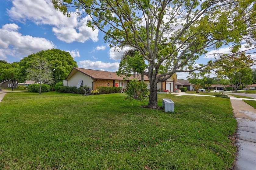 Welcome to this beautifully maintained rare 3-bedroom home that - Beach Home for sale in Palm Harbor, Florida on Beachhouse.com