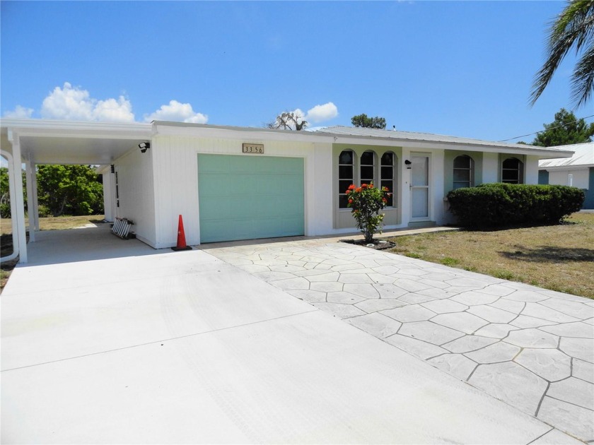 This home has it all!  A canal with a deck to sit on down by the - Beach Home for sale in Port Charlotte, Florida on Beachhouse.com