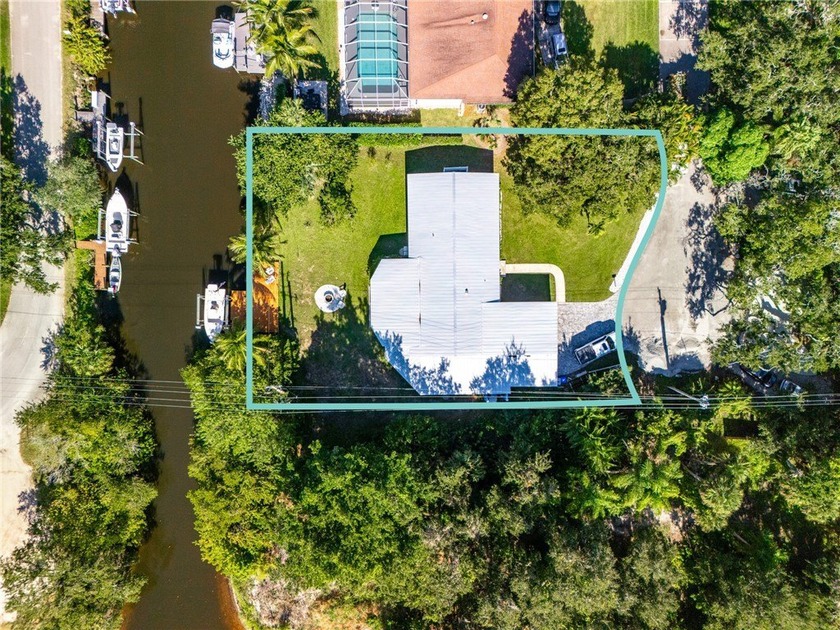 CANALFRONT HOME W/ PRIVATE DOCK & LIFT in coveted Country Club - Beach Home for sale in Vero Beach, Florida on Beachhouse.com