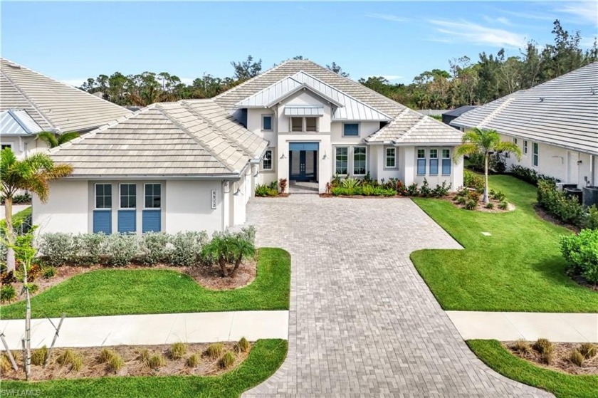 Indulge in modern luxury at this exquisite Covington III Model - Beach Home for sale in Naples, Florida on Beachhouse.com