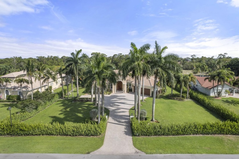 Seven bedrooms total, 5458 square feet on 1.04 acres with 5 - Beach Home for sale in Lake Worth, Florida on Beachhouse.com