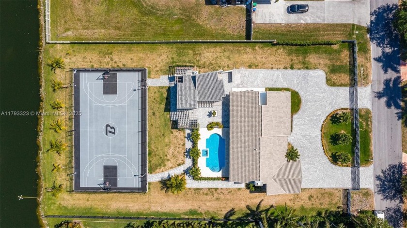 Exquisite Lakeside Retreat with full size basketball court. This - Beach Home for sale in Miramar, Florida on Beachhouse.com