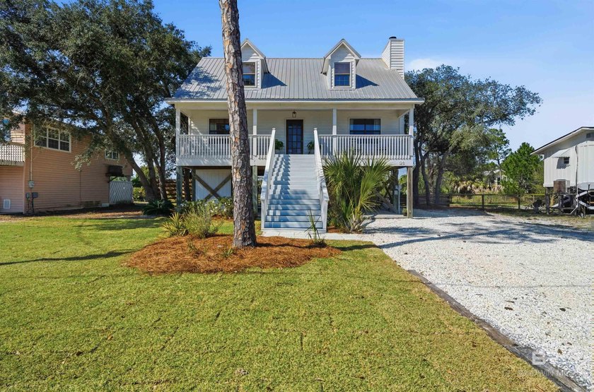 Welcome to this enchanting coastal cottage, the perfect blend of - Beach Home for sale in Gulf Shores, Alabama on Beachhouse.com
