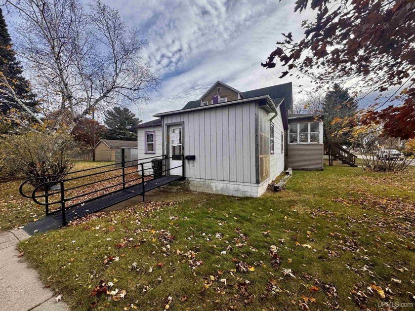 Foreclosure Opportunity!  Corner lot property with potential for - Beach Home for sale in Escanaba, Michigan on Beachhouse.com