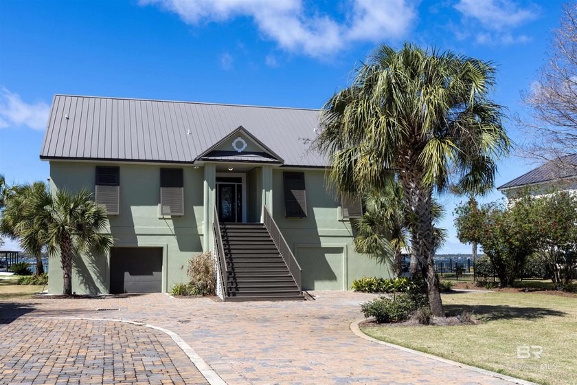 Experience waterfront living on Ono Island with this exceptional - Beach Home for sale in Orange Beach, Alabama on Beachhouse.com