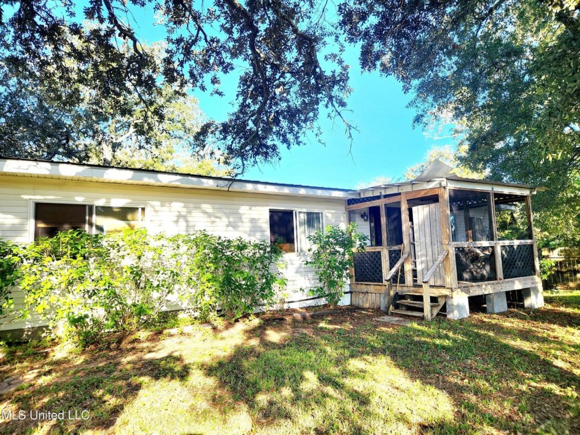 This spacious 3-bedroom, 2-bath property on a prime fenced - Beach Home for sale in Long Beach, Mississippi on Beachhouse.com