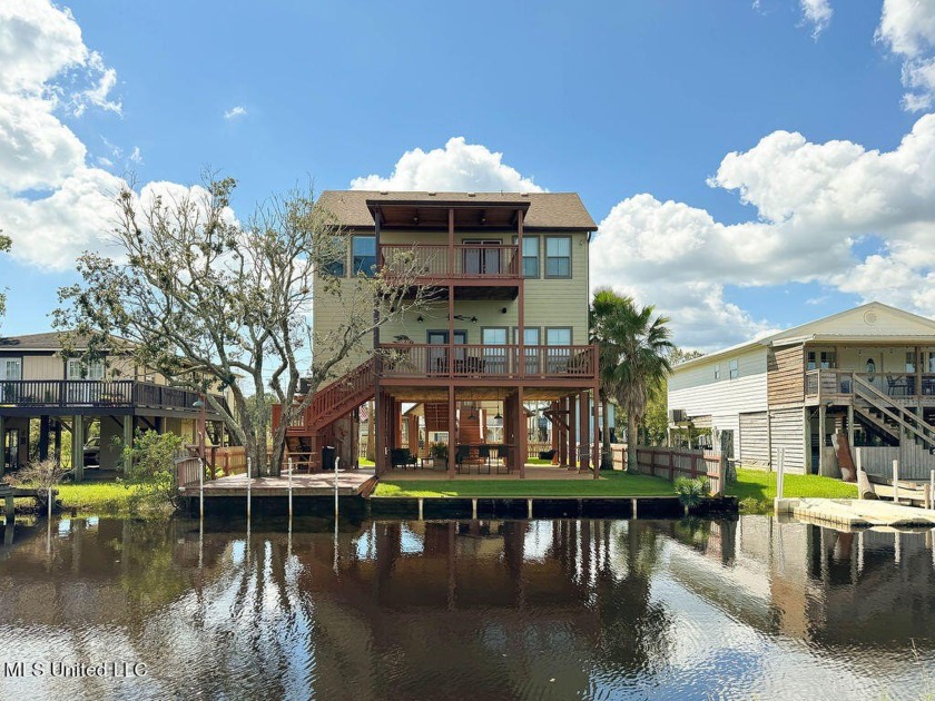 Immerse yourself in this breathtaking waterfront retreat - Beach Home for sale in Bay Saint Louis, Mississippi on Beachhouse.com