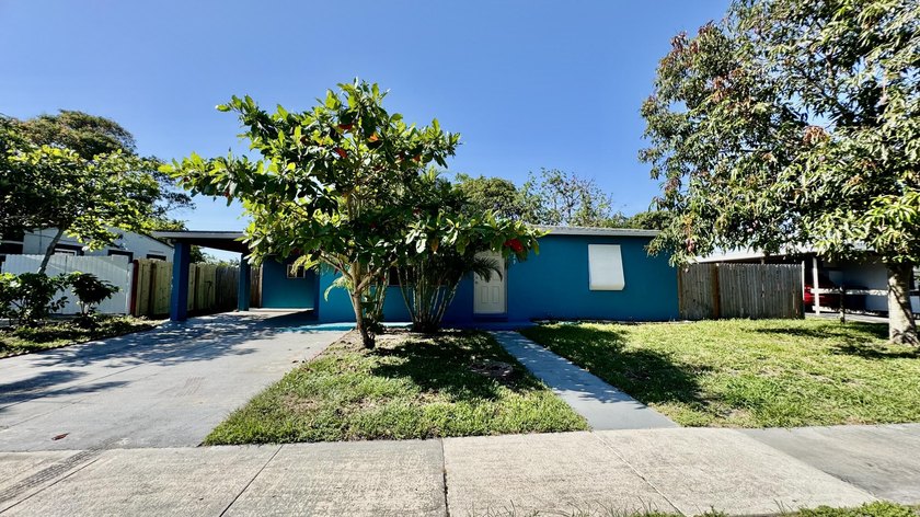 This Centrally located home with NO HOA offers convenience and - Beach Home for sale in West Palm Beach, Florida on Beachhouse.com
