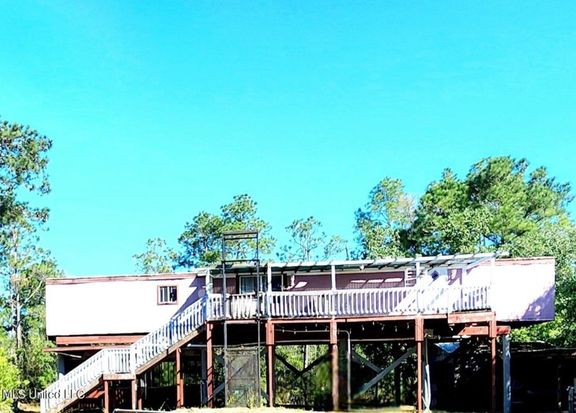 Escape to tranquility with this elevated mobile home, nestled at - Beach Home for sale in Bay Saint Louis, Mississippi on Beachhouse.com