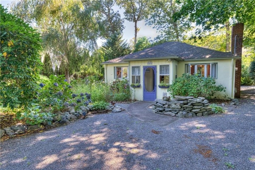 Tucked among the trees in the sought-after Pettaquamscutt - Beach Home for sale in Narragansett, Rhode Island on Beachhouse.com