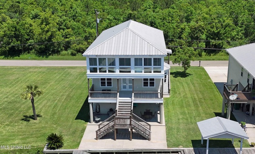 Experience waterfront luxury living at its finest! Step into - Beach Home for sale in Bay Saint Louis, Mississippi on Beachhouse.com