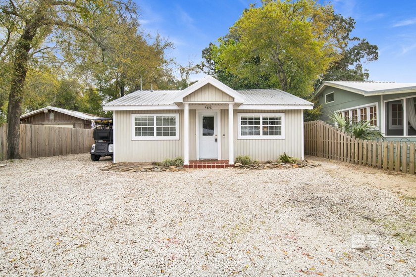 Welcome to this beautifully updated cottage located in the heart - Beach Home for sale in Orange Beach, Alabama on Beachhouse.com