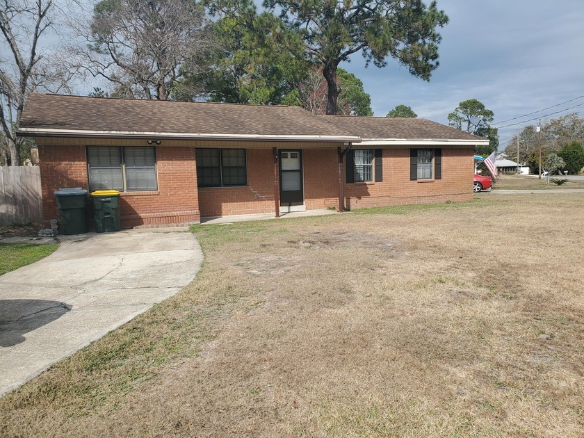 This charming brick home with 4 bedrooms and two baths is - Beach Home for sale in Fort Walton Beach, Florida on Beachhouse.com