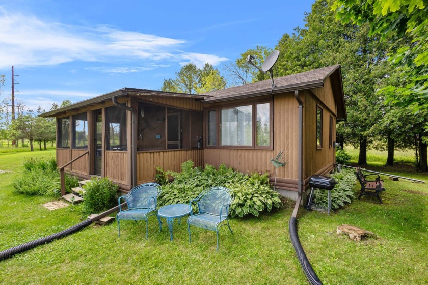 Everyday is a vacation in this seasonal cozy cottage on the - Beach Home for sale in Kewaunee, Wisconsin on Beachhouse.com