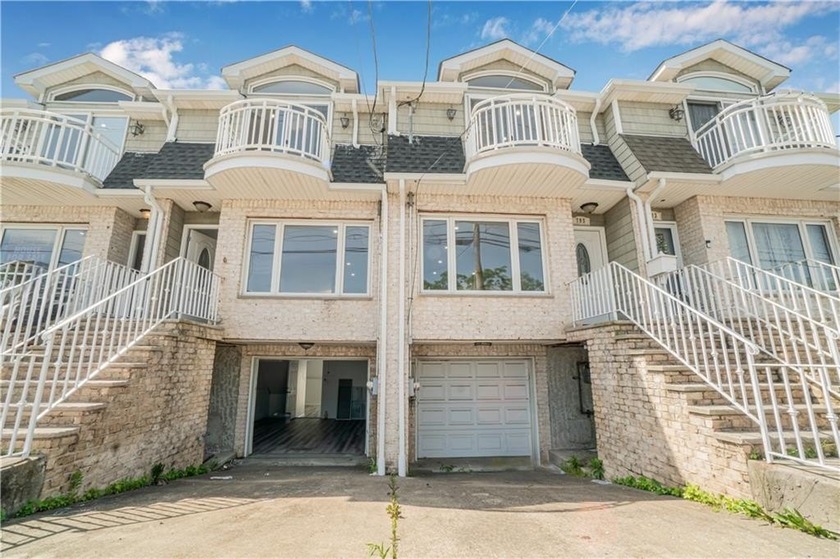 Welcome to this beautifully renovated attached single-family - Beach Home for sale in Staten  Island, New York on Beachhouse.com