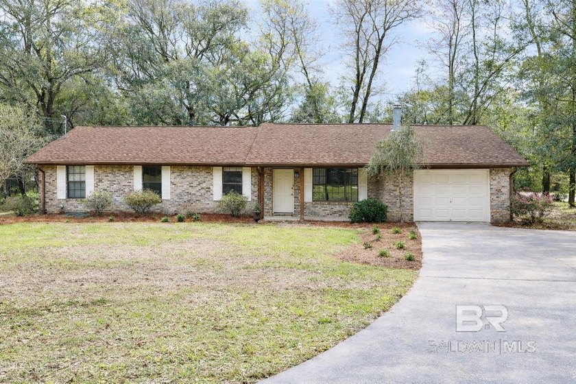 This charming home is nestled quietly in a wooded corner lot - Beach Home for sale in Lillian, Alabama on Beachhouse.com