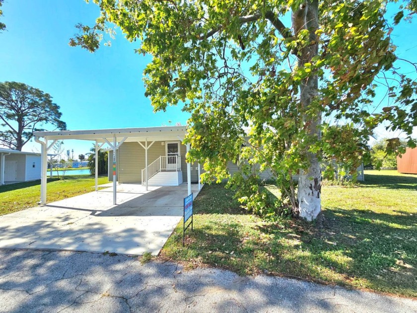 RARE 4 BEDROOM HOME WITH LAKE VIEW IN AN ALL AGE PARK!! This - Beach Home for sale in North Fort Myers, Florida on Beachhouse.com