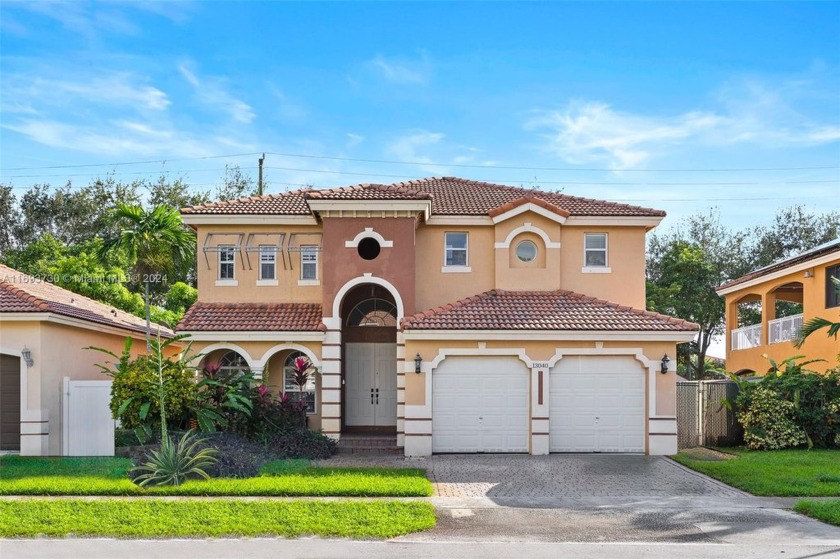 Discover this stunning 4-bedroom, 2-bathroom home in the gated - Beach Home for sale in Miramar, Florida on Beachhouse.com