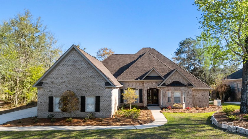 Welcome to this immaculately maintained waterfront home that - Beach Home for sale in Spanish Fort, Alabama on Beachhouse.com