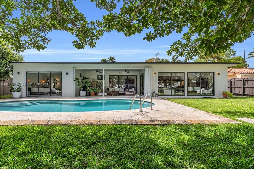 Experience the pinnacle of refined waterfront living in this - Beach Home for sale in North Miami, Florida on Beachhouse.com