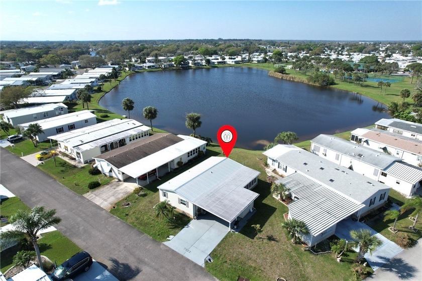 Coastal Sophistication with Stunning Lake Views! This - Beach Home for sale in Micco, Florida on Beachhouse.com