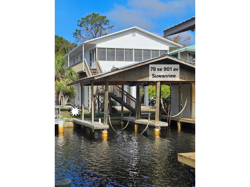 Stilted 3/2 with boathouse and 2 lifts. Large fish cleaning - Beach Home for sale in Suwannee, Florida on Beachhouse.com