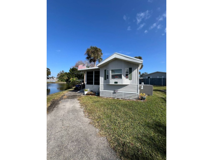 Imagine walking out onto your deck overlooking a small lake - Beach Home for sale in Rockledge, Florida on Beachhouse.com