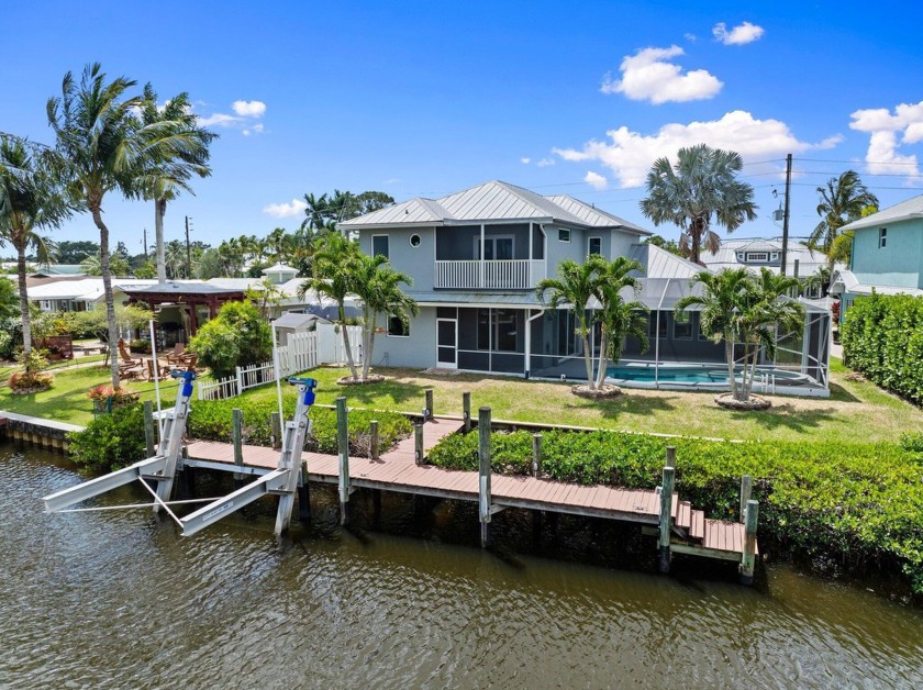 Paradise Found! Discover this stunning 2-story CBS waterfront - Beach Home for sale in Palm City, Florida on Beachhouse.com