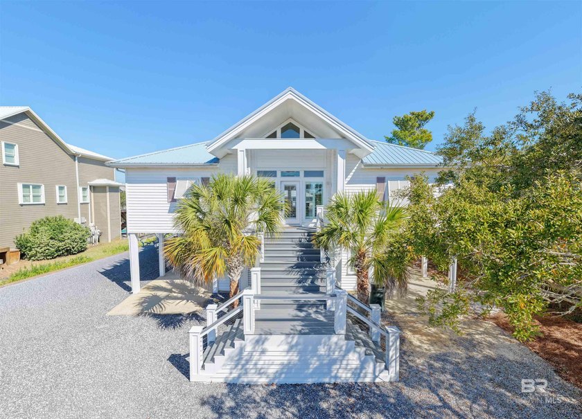 Welcome to 32315 River Road.  This beautifully maintained CANAL - Beach Home for sale in Orange Beach, Alabama on Beachhouse.com
