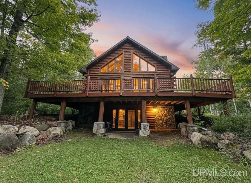 Nestled on 3.69 wooded acres, this beautiful log home offers the - Beach Home for sale in Gladstone, Michigan on Beachhouse.com