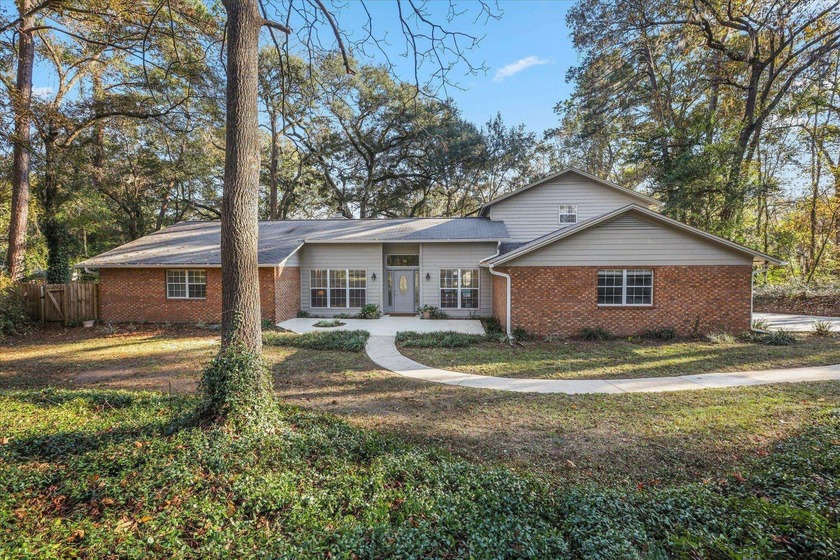 Set on two+ acres shaded by beautiful mature oaks, this home - Beach Home for sale in Tallahassee, Florida on Beachhouse.com