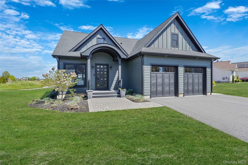 Set within the sought after Estates at Old Vine community and - Beach Home for sale in Riverhead, New York on Beachhouse.com