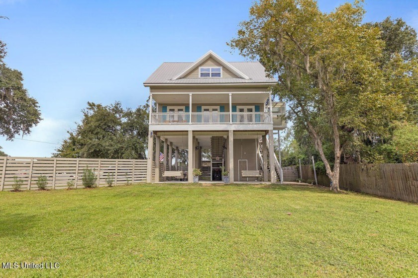 This charming, like new raised cottage overlooking beautiful - Beach Home for sale in Pass Christian, Mississippi on Beachhouse.com