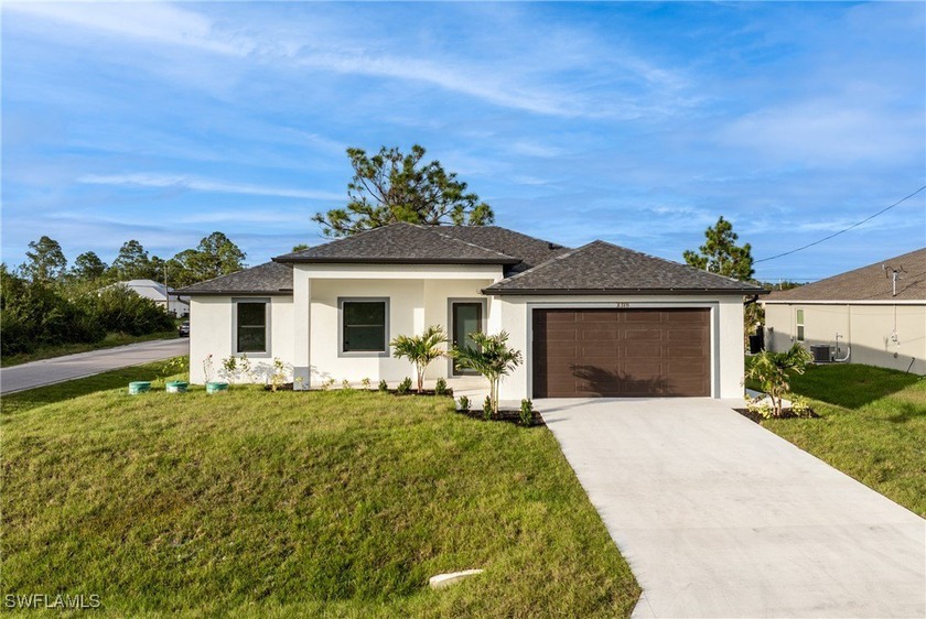 This exquisite 4-bedroom, 3-bathroom home with a 2-car garage is - Beach Home for sale in Lehigh Acres, Florida on Beachhouse.com
