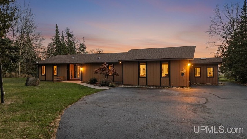 Secluded and stunning, this two-bedroom, two-bathroom home - Beach Home for sale in Bark River, Michigan on Beachhouse.com