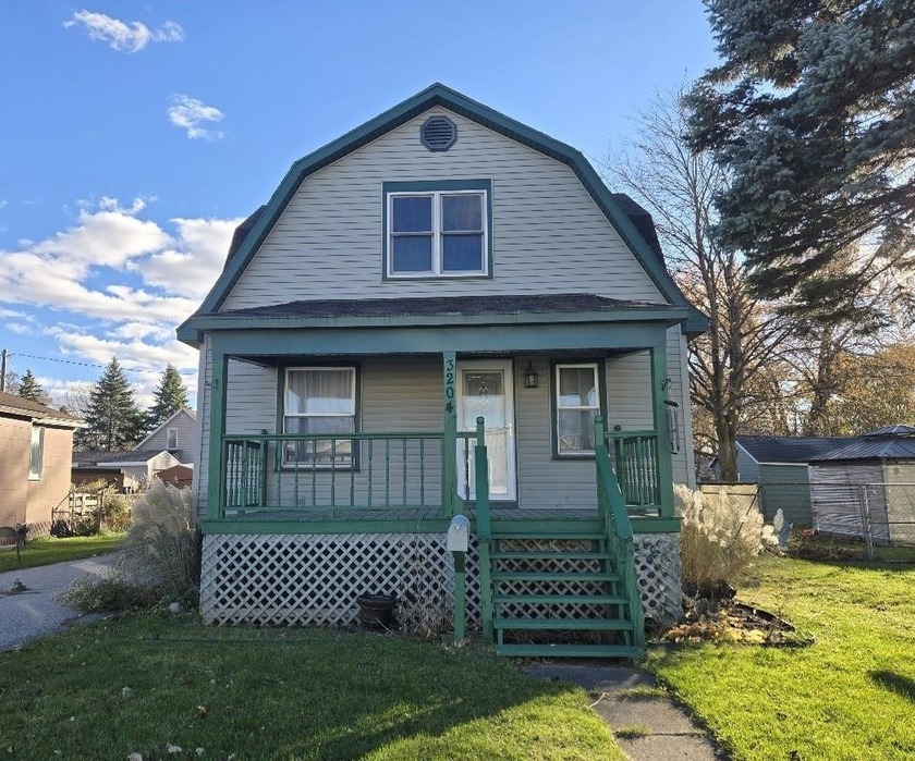 This charming 1910 Dutch Colonial Sears Catalog kit home has - Beach Home for sale in Bay City, Michigan on Beachhouse.com