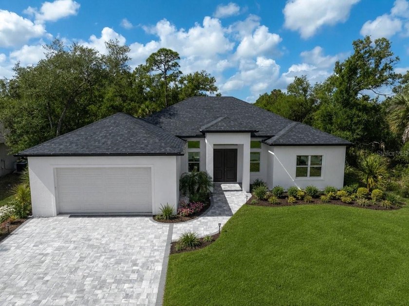 Modern luxury meets everyday functionality with a design that - Beach Home for sale in North Port, Florida on Beachhouse.com