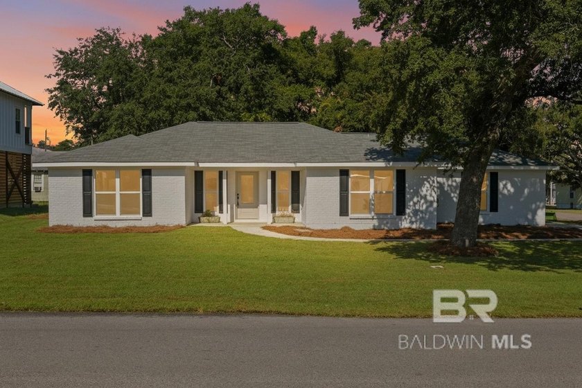 Fully renovated and tucked away in Bear Point Estates, this - Beach Home for sale in Orange Beach, Alabama on Beachhouse.com
