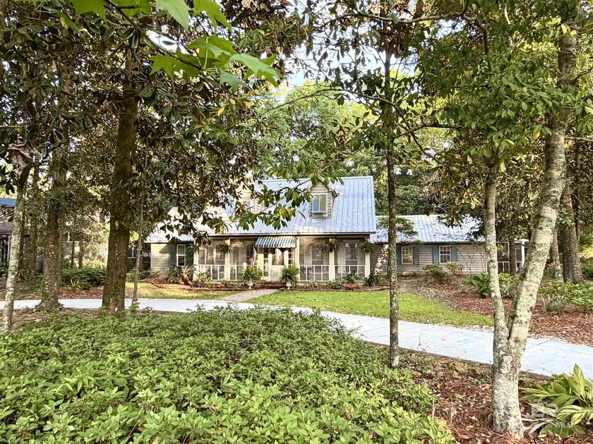 Tucked back on a picturesque corner lot in sought-after Olde - Beach Home for sale in Daphne, Alabama on Beachhouse.com