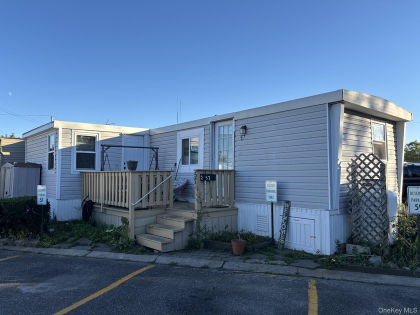 Updated in 2023, this charming unit features an open-concept - Beach Home for sale in Islip, New York on Beachhouse.com