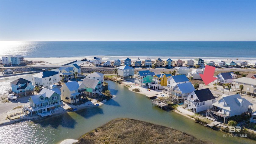 124 Sand Dune Lane is a COASTAL, WATERFRONT BEAUTY! The home's - Beach Home for sale in Gulf Shores, Alabama on Beachhouse.com