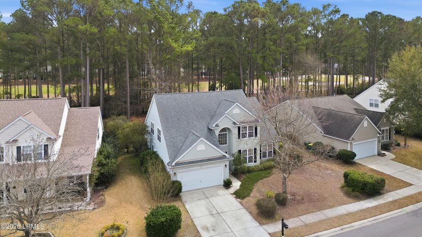 Situated on a large lot with golf course views, this 4-bedroom - Beach Home for sale in Bluffton, South Carolina on Beachhouse.com