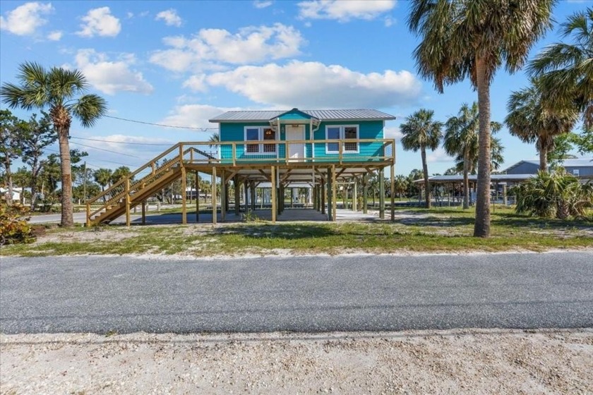 Perched on 8-foot stilted pilings, this charming 3-bedroom - Beach Home for sale in Horseshoe Beach, Florida on Beachhouse.com