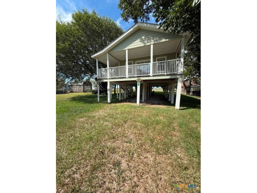 Nestled beneath a canopy of mature oak, ash, and pecan trees - Beach Home for sale in Palacios, Texas on Beachhouse.com
