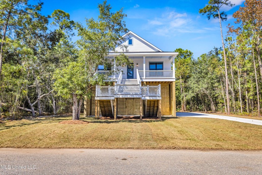 This beautiful new construction is a quick golf cart ride to all - Beach Home for sale in Pass Christian, Mississippi on Beachhouse.com