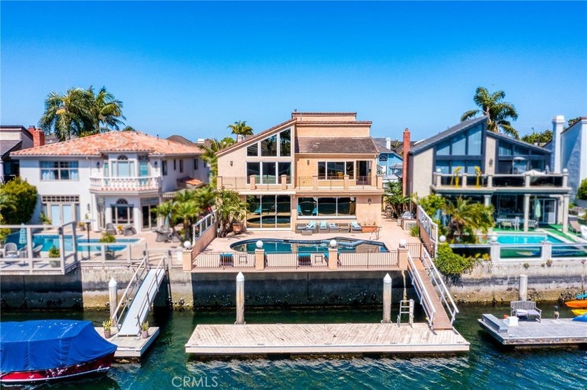 Nestled within the 24-hour guard-gated enclave of Harbour Coves - Beach Home for sale in Huntington Beach, California on Beachhouse.com