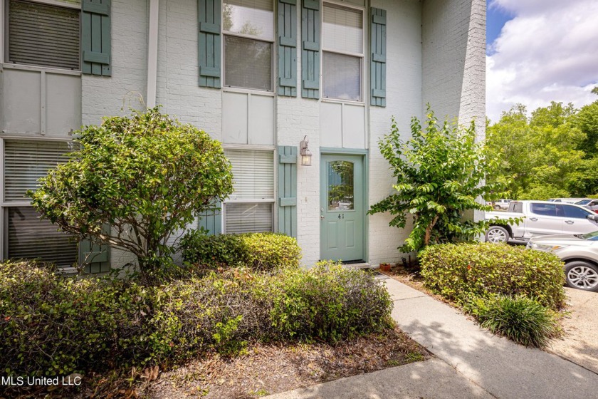 This practical two-story condo is nestled near  serene Fort - Beach Condo for sale in Ocean Springs, Mississippi on Beachhouse.com